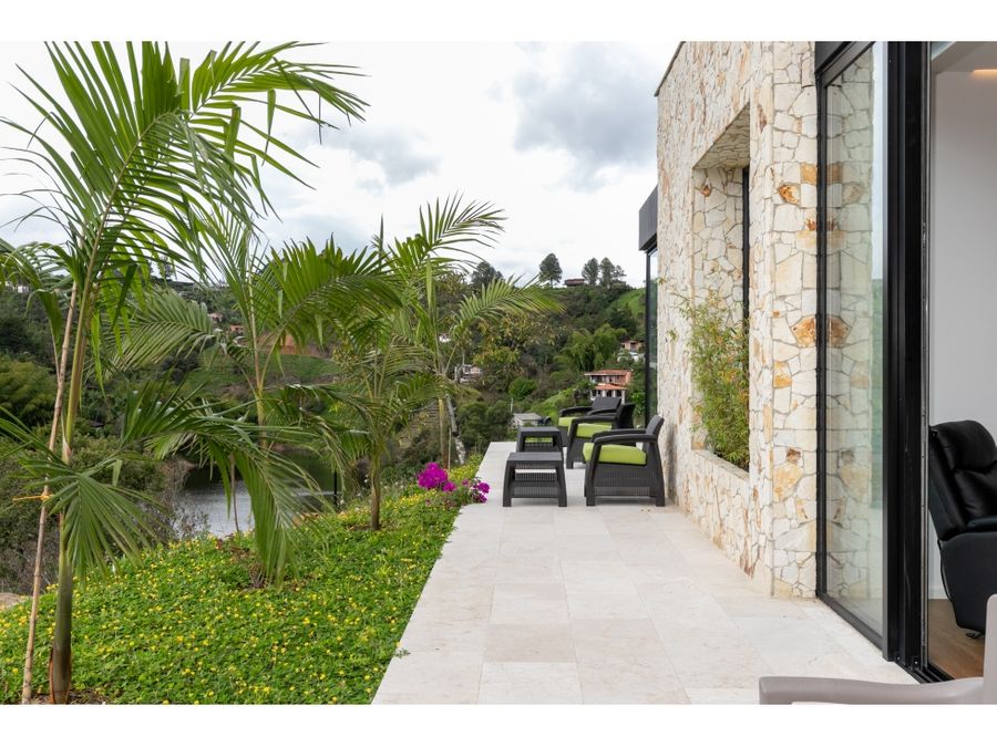 lake view luxury house for sale guatape with tennis court